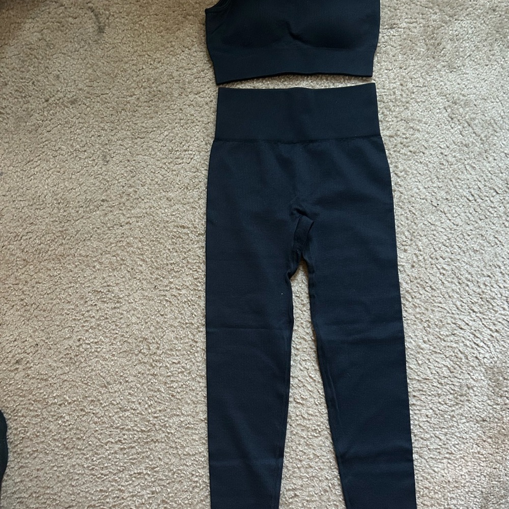 Women's Black Sports bra and high waisted leggings.